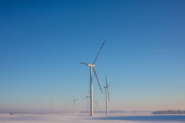 istock wind turbines during winter landscape 1448578151