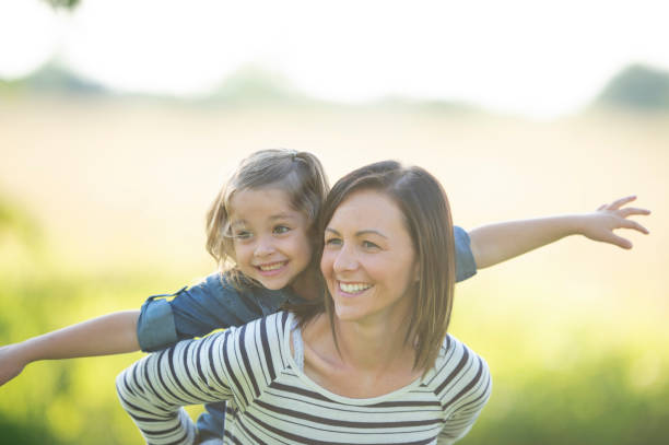 istock Mother Piggybacking Daughter 1448581171