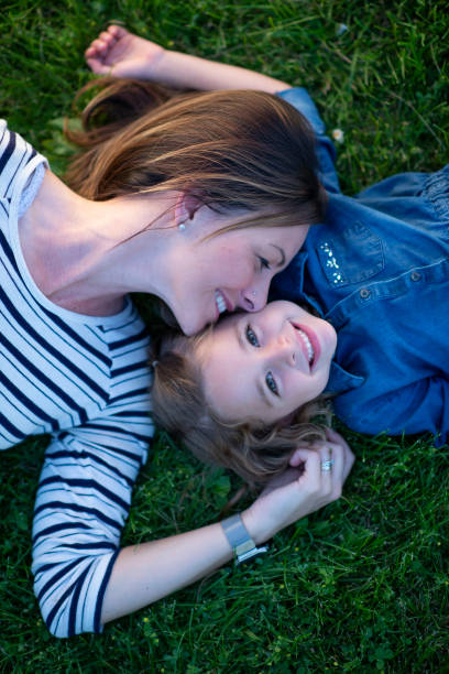 istock Laying in the Grass with Mom 1448581179