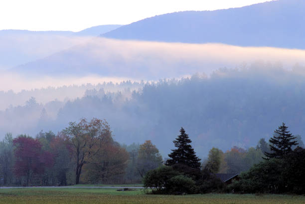 istock Thick morning fog lifting from Vermont countryside 1448581285