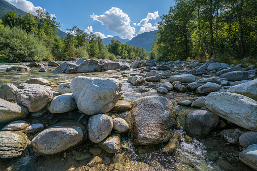 Low-angle view of the rocks in the river Rhine in late summer, Grisons, Switzerland