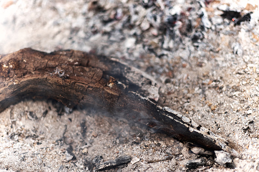 Close-up of the embers of a bonfire with abundant ash