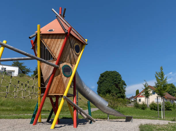 istock Modern colorful play tower with tunnel slide on a public playground 1448584816
