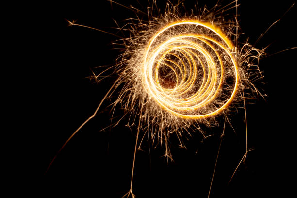 istock Circles with sparks on a black background. Festive sparklers, New Year's abstract lights 1448585428