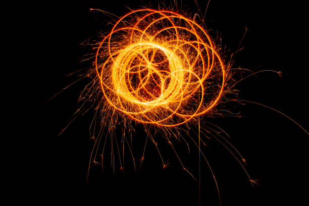 istock Circles with sparks on a black background. Festive sparklers, New Year's abstract lights. 1448585463