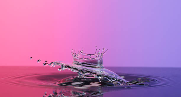 istock Water splash like crown on color background 1448586769