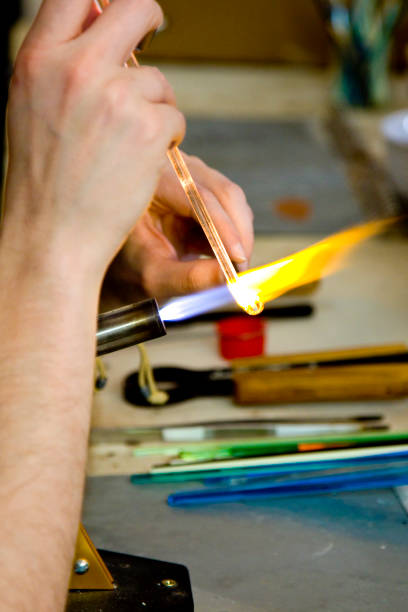 istock Glass artisan at work heating glass 1448588983
