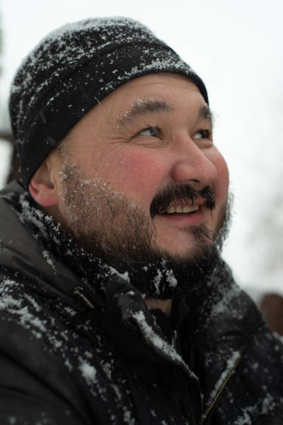 istock Portrait of a man with a beard outdoors in winter. 1448589458