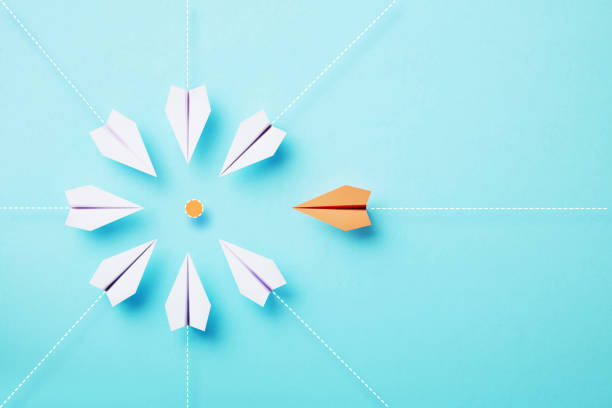 istock Paper Planes Moving Toward An Orange Target On Blue Background 1448592534