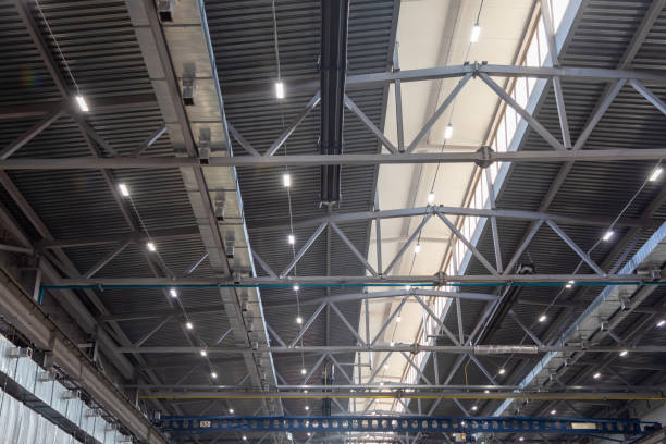 istock Ceiling with metal beams, air purification and ventilation system, lighting devices in the production shop. Ventilation system in the metalworking shop 1448592714