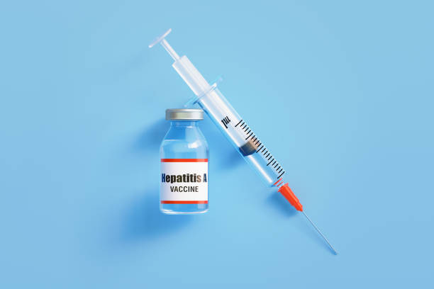 istock Hepatitis A Vaccine and Syringe On Blue Background 1448594287
