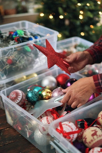 istock Decorating Christmas Tree with Ornaments and Christmas Lights 1448594327