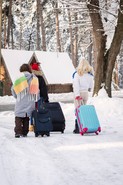 istock Family with suitcases arrived on the winter vacation 1448598111