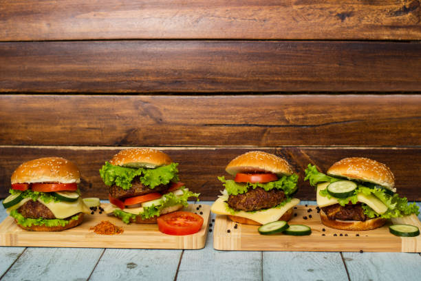 istock Fresh grilled burgers served on wood table 1448603545