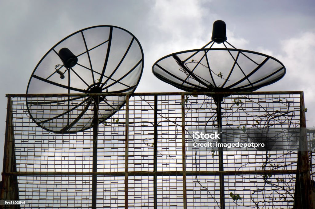Satellite dishes on rooftop of residential building Close up satellite dishes on rooftop of residential building in Bangkok, Thailand 5G Stock Photo