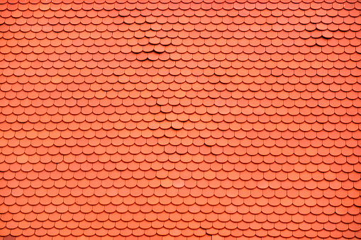 Tropical shingle layer on roof, natural pattern house or cottage. Texture background. Nature material.