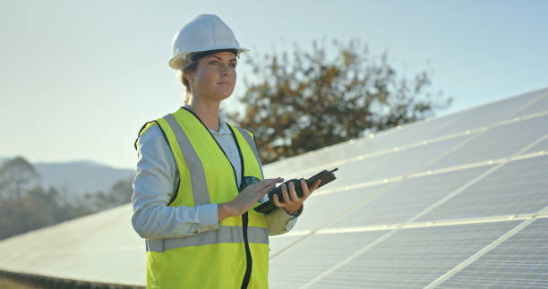 istock Solar energy, woman engineer and planning on tablet for construction, architecture project and roof building. Female electrician, solar panels and digital ideas, vision and future of sustainability 1448604936