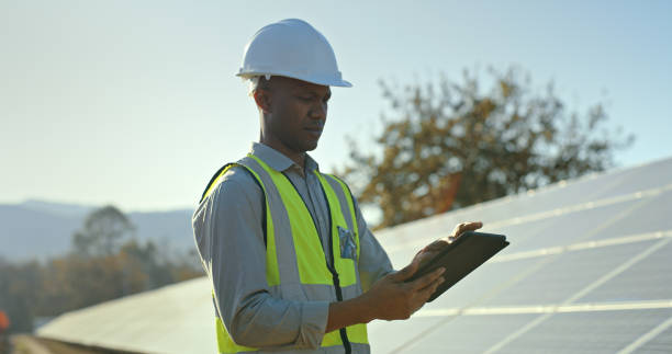 istock Solar power, tablet and male engineer outside to plan environment green electricity project. Photovoltaic contractor, african american man and digital tablet for renewable energy panels 1448604939
