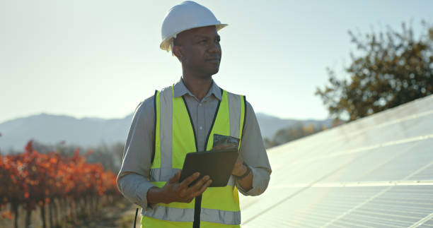 istock Engineer, tablet and solar panels outdoor on farm with black man doing maintenance and inspection for sustainability, innovation and renewable energy. Technician working on photovoltaic system 1448604944