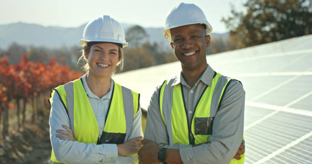 istock Solar energy, team and portrait of engineers with pride on a farm to plan solar panel installation for renewable energy. Eco friendly, power and construction colleagues or technician people outside 1448604945