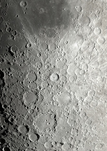 Partly illuminated moon in the dark night sky over Western Europe on January 18, 2024. The surface of the moon is clearly visible with various craters and seas.
