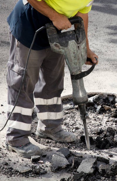 istock jackhammer in hands of asphalt worker logging 1448606202