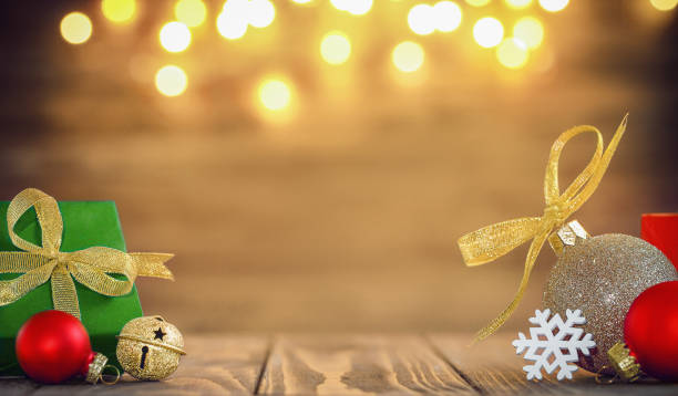 istock Christmas decorations on a wooden surface with bokeh. place for text, product. 1448606951