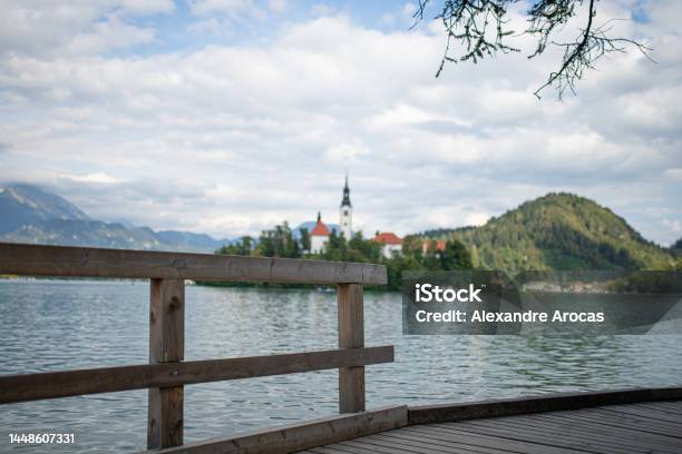 Wooden Walkway Surrounding The Lego Bled Stock Photo - Download Image Now - No People, Blue, Church