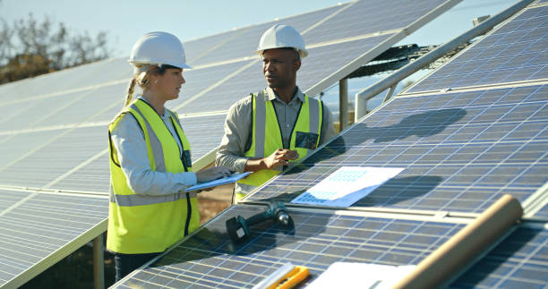 istock Solar panels, construction and engineering staff working of sustainability and renewable energy. Solar energy, ecology maintenance and contractor planning of a clean energy team building outdoor 1448607399