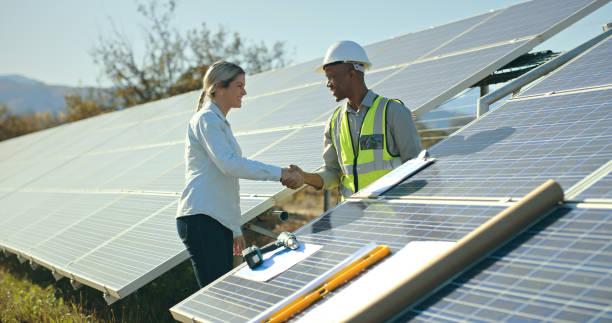 istock Solar energy, teamwork and handshake for successful deal for solar panel construction between engineer team. Eco friendly, hand shake and renewable energy technology or photovoltaic agreement 1448607400