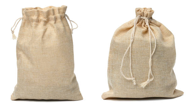 istock Full canvas bag tied with rope and isolated on a white background 1448608546