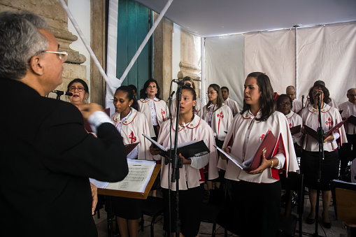 Salvador, Bahia, Brazil - May 26, 2016: Catholics are singing in the church choir for the tribute to corpus christ, in the city of Salvador, Brazil.