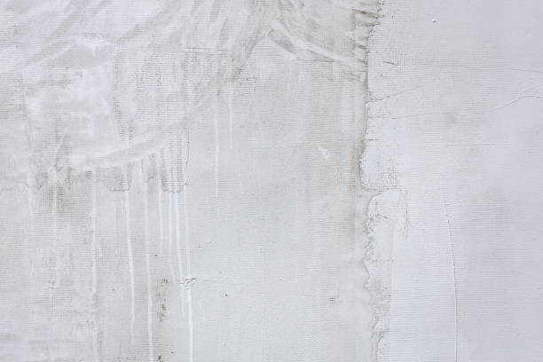 istock Cement wall background, close-up with spots and transitions 1448612664