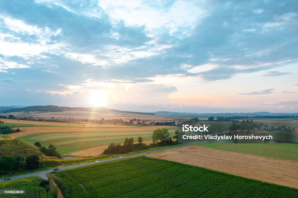 Rural scene, sunset in the meadow, summer evening Farm Stock Photo
