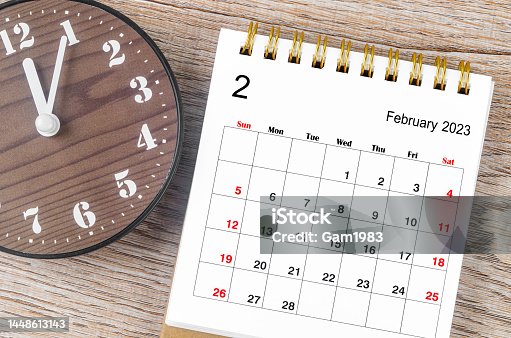 istock The February 2023 Monthly desk calendar for 2023 year with wooden clock. 1448613143