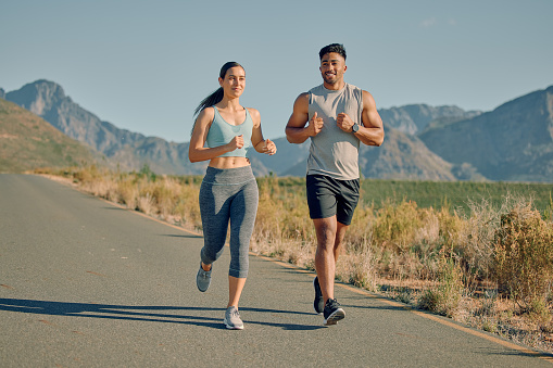 Mountains road, fitness and running couple of friends with goal for health, body and wellness in nature on blue sky mockup. Sports, athlete or runner people on street for outdoor workout and training