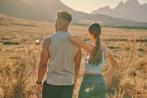 Nature fitness, hiking and couple in the countryside, walking and training with a mountain view. Freedom exercise, sports environment and back of a man and woman in the mountains of Peru for cardio