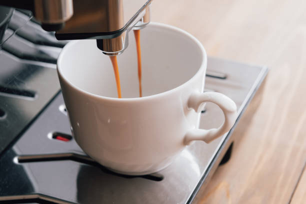 istock Espresso coffee preparation on a wooden table 1448621961
