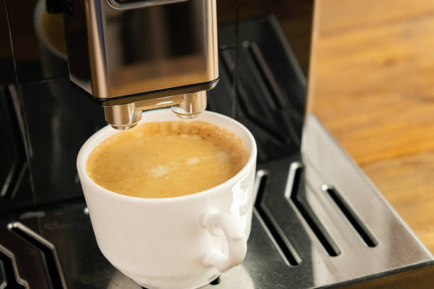 istock Espresso coffee preparation on a wooden table 1448621971