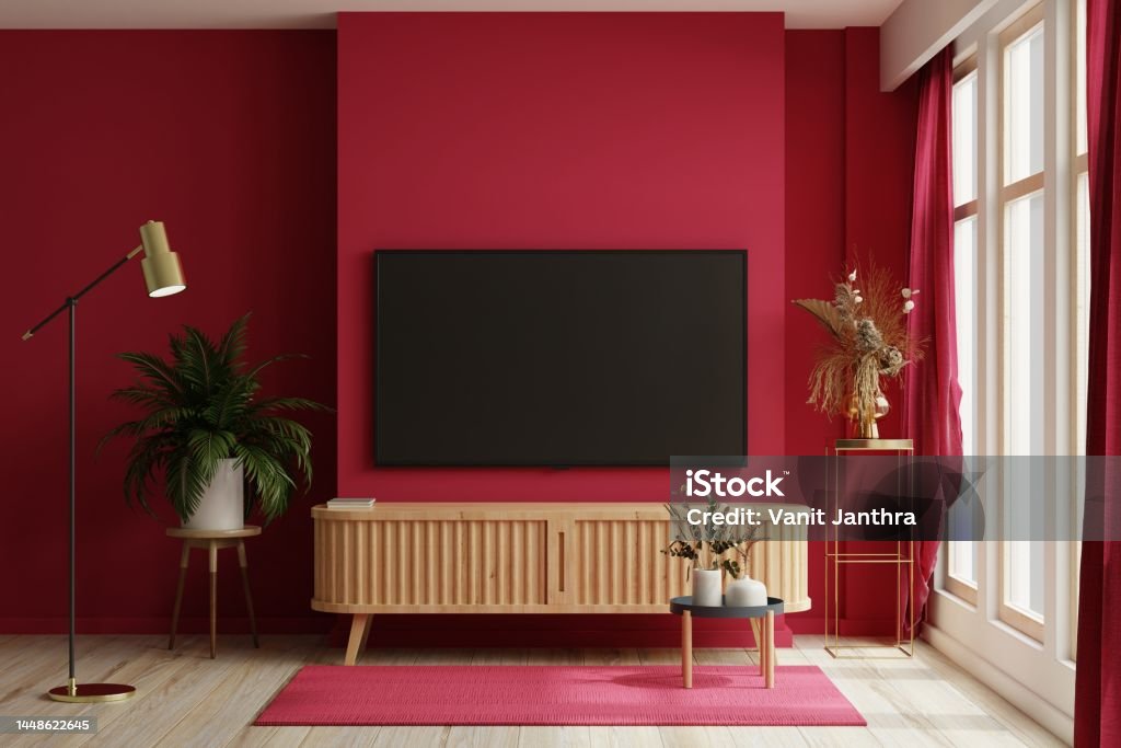 TV on the cabinet in modern living room on white viva magenta wall background. TV on the cabinet in modern living room on white viva magenta wall background.3d rendering Red Stock Photo