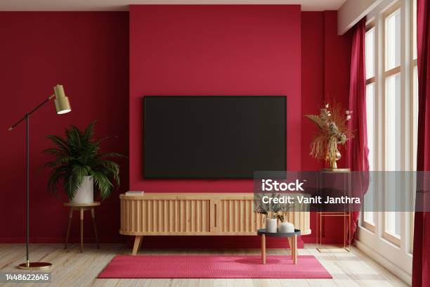 Tv On The Cabinet In Modern Living Room On White Viva Magenta Wall Background Stock Photo - Download Image Now