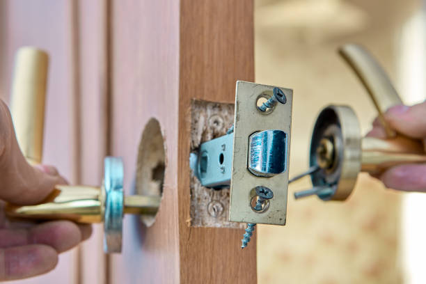 Fixing faulty lever doorhandle with latch on an interior door. Repair of faulty lever door handle in interior door. door lever stock pictures, royalty-free photos & images