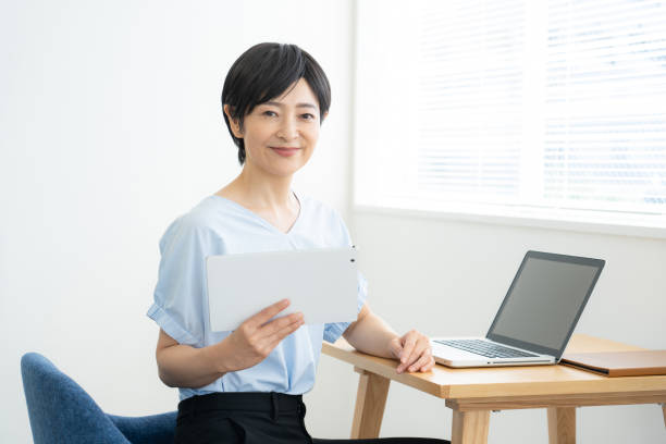 Japanese woman doing desk work stock photo