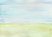 istock Watercolor minimalist green field and blue skies as background. 1448632108