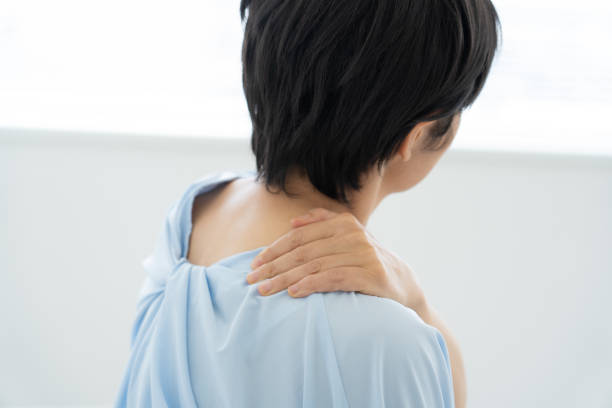 istock Woman suffering from stiff shoulders 1448632314