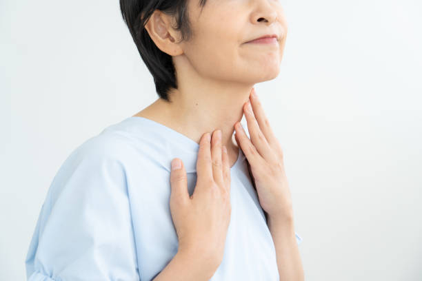 istock Woman suffering from sore throat 1448632391