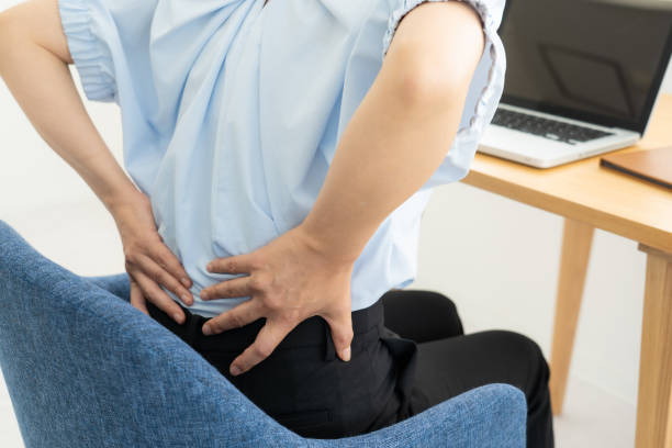 istock Woman suffering from back pain 1448632584