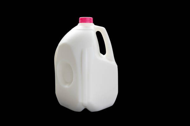 A 4 Litres milk jug on a black background A 4 Litres milk jug on a black background milk jug stock pictures, royalty-free photos & images