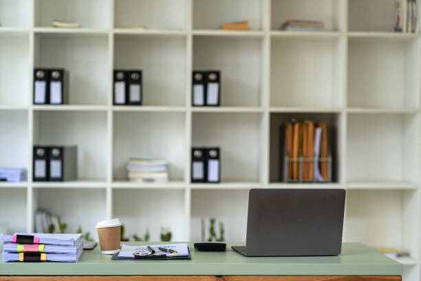 istock Business finance office concept on table with laptop computer and graph document calculator 1448645082
