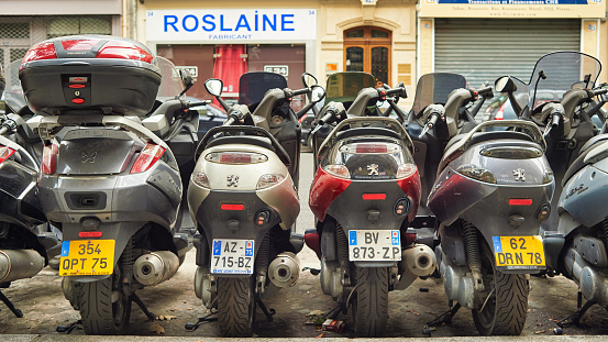 paris, france - august 09, 2015: close up shot of scooters parked in the street of paris.